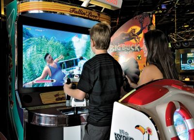Pre-teens playing arcade games at Atlantis Fun Center
